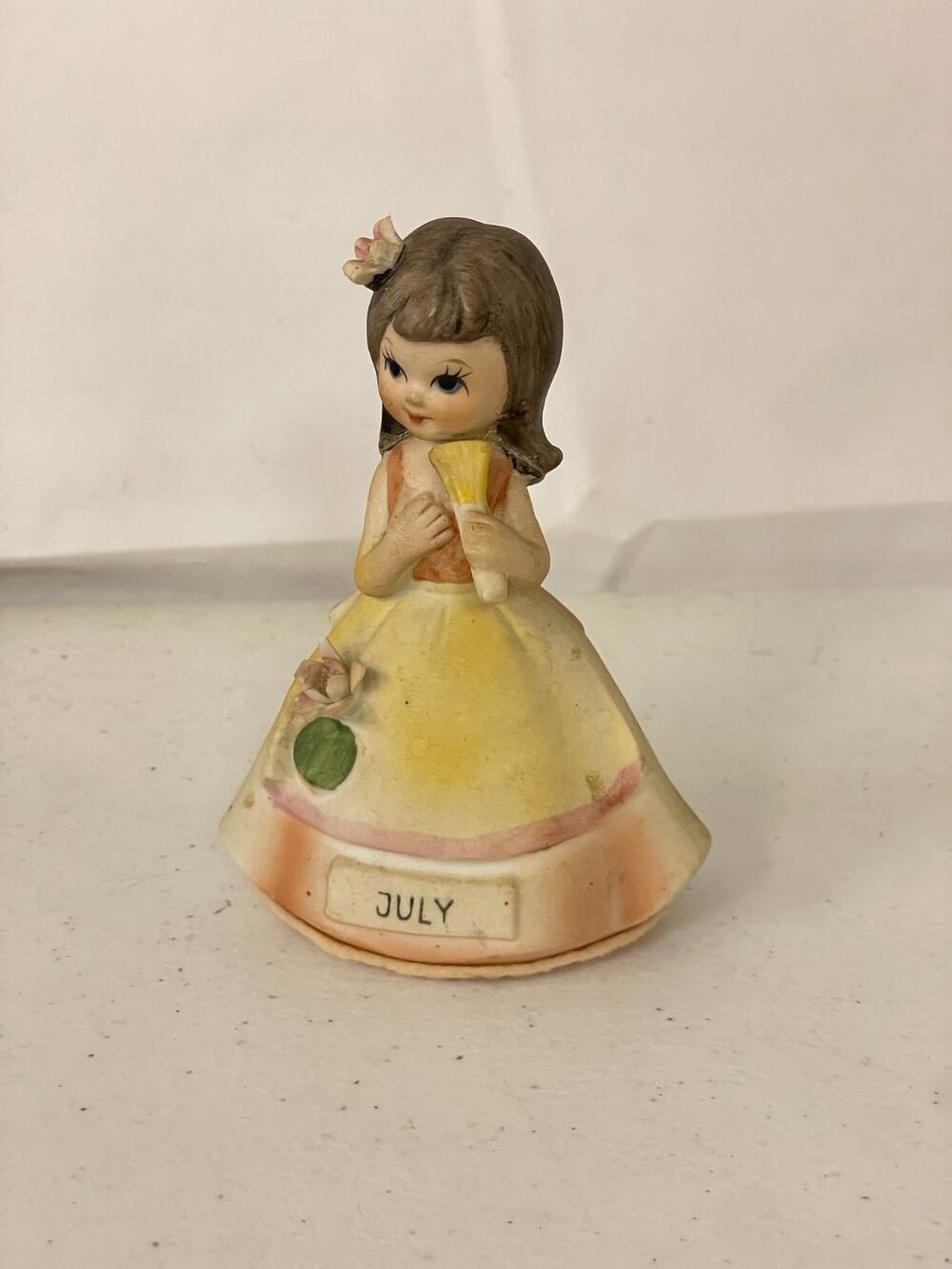 Vintage Collectible July Birthday Girl Figure with Fan Yellow Gown Floral Detail